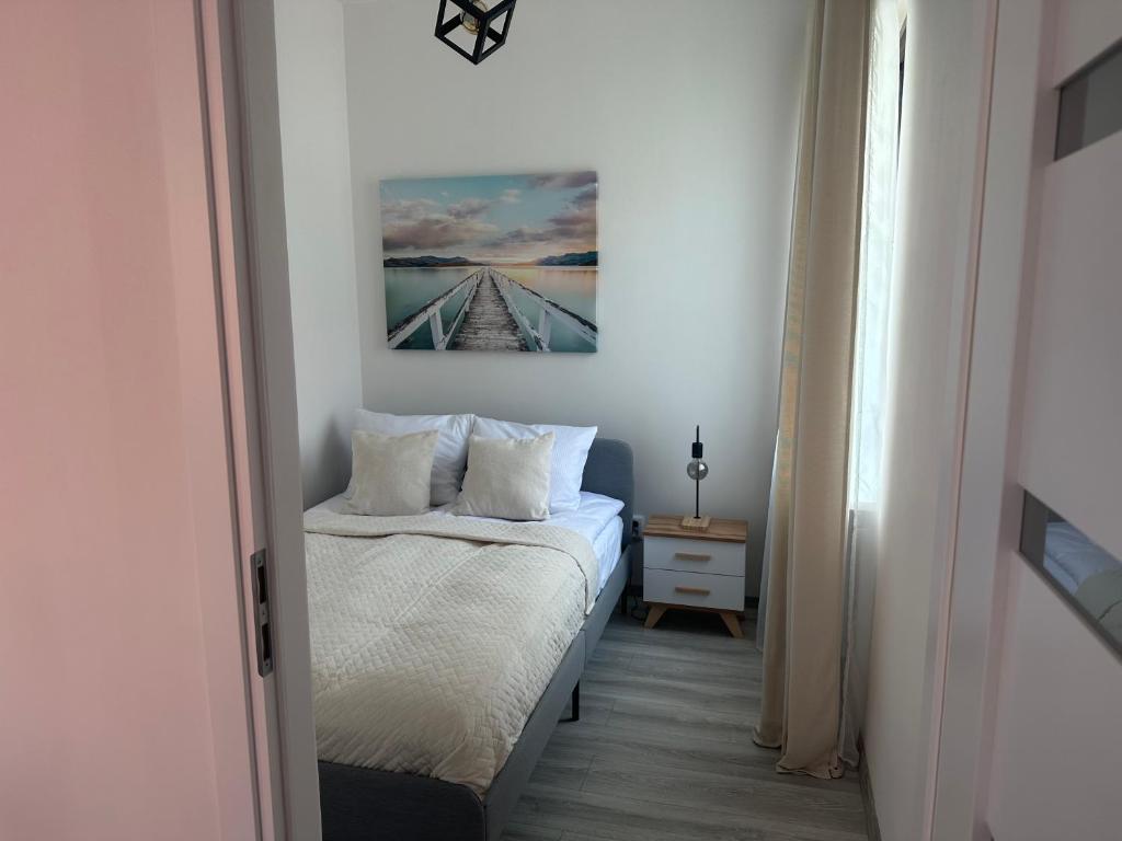 Postel nebo postele na pokoji v ubytování Apartamenty Przy Deptaku