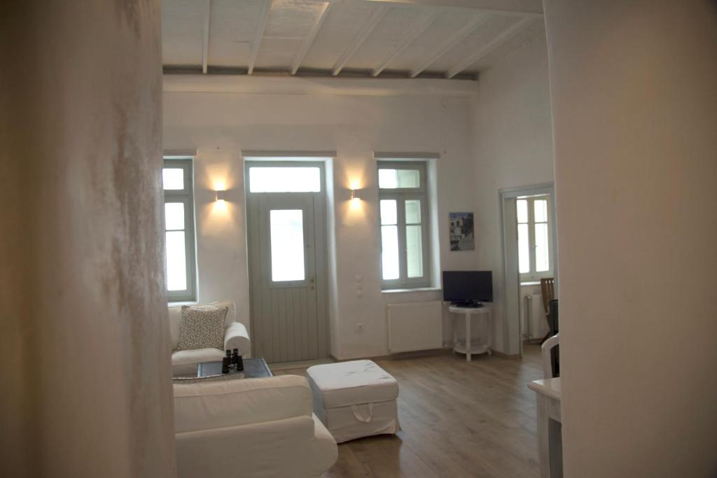 a living room with a couch and a table at Traditional Village House in Istérnia
