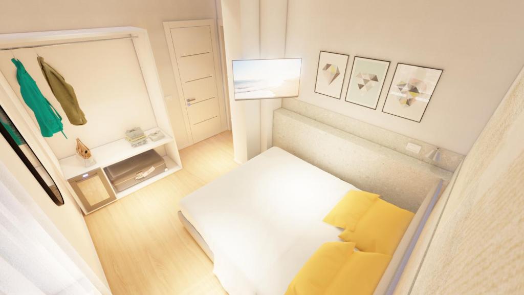 Postel nebo postele na pokoji v ubytování Harbor Rooms - Cala Gonone