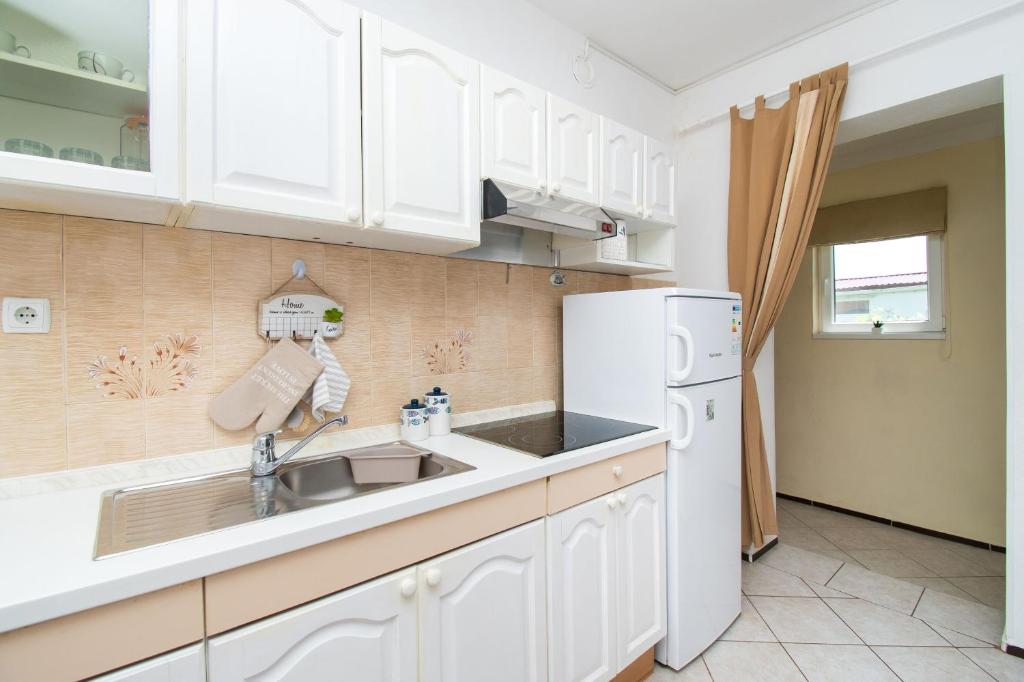 Kuchyň nebo kuchyňský kout v ubytování Apartment Ivan Vrsi