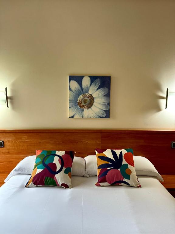 A bed or beds in a room at Pension Anoeta