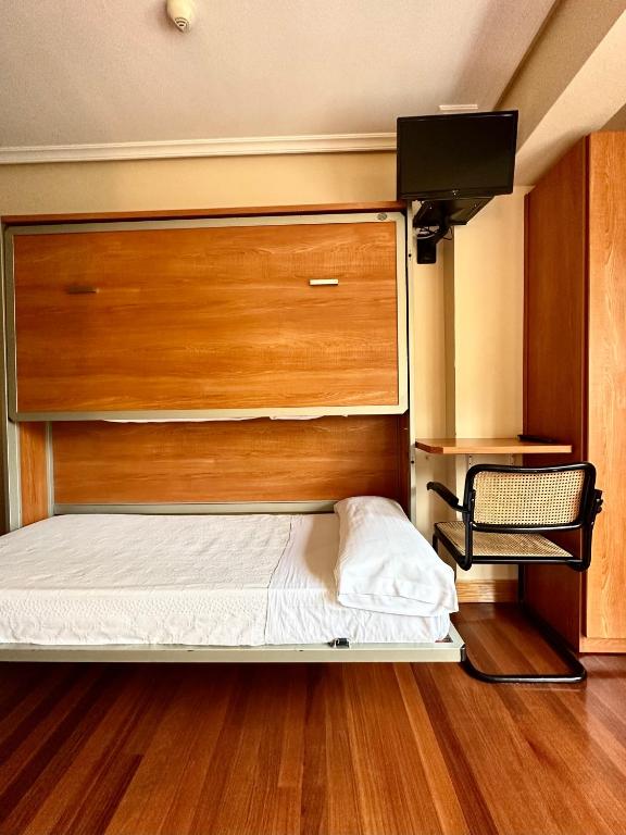 A bed or beds in a room at Pension Anoeta