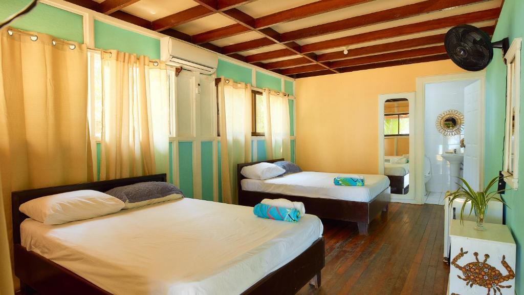 Postel nebo postele na pokoji v ubytování Arrecife Punta Uva - Hospedaje, bar y restaurante - Frente al mar