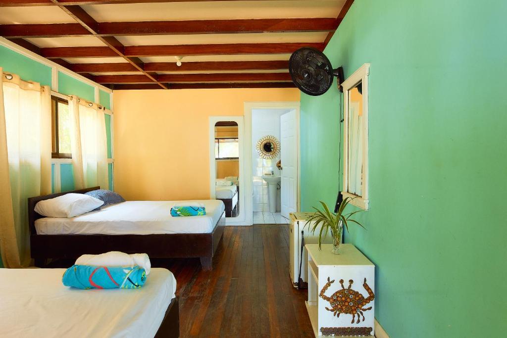 Postel nebo postele na pokoji v ubytování Arrecife Punta Uva - Hospedaje, bar y restaurante - Frente al mar