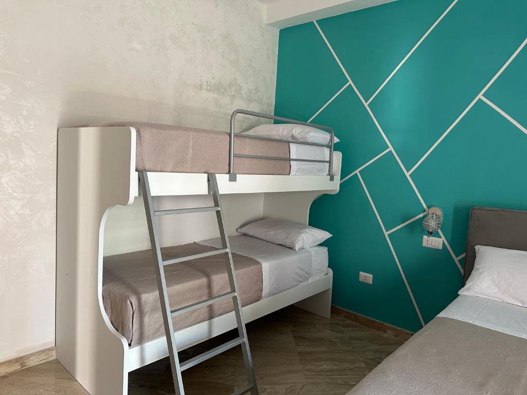 Postel nebo postele na pokoji v ubytování AL CENTRO
