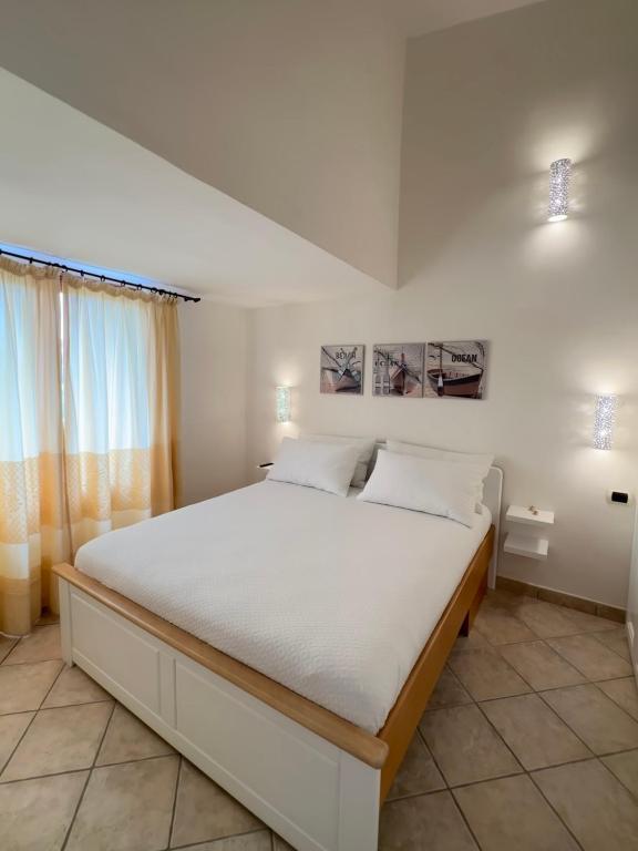 Posteľ alebo postele v izbe v ubytovaní Sardegna Costa Corallina Appartamento Luxury Vista Mare in splendido villaggio - IUN R6511
