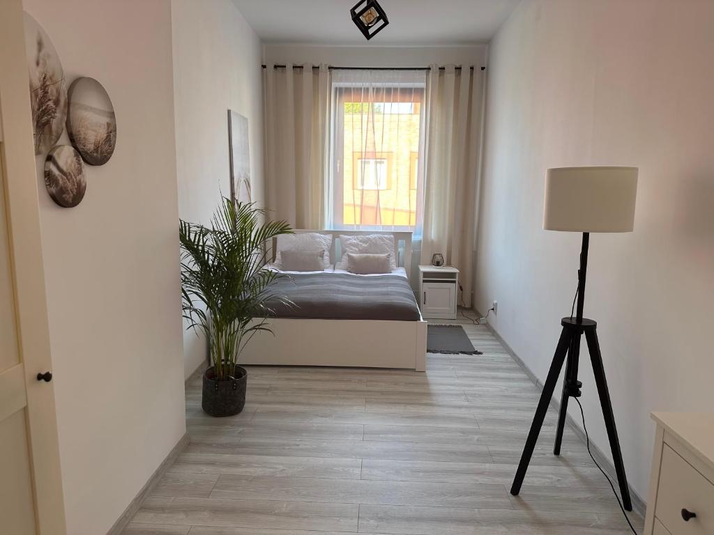 Postel nebo postele na pokoji v ubytování Apartamenty Przy Deptaku