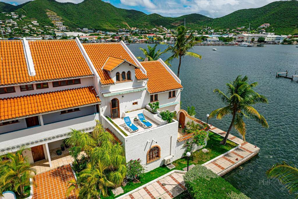 an aerial view of a house on the water at CasaPisani Tranquil 2Bed condo SimpsonBayYachtClub in Simpson Bay