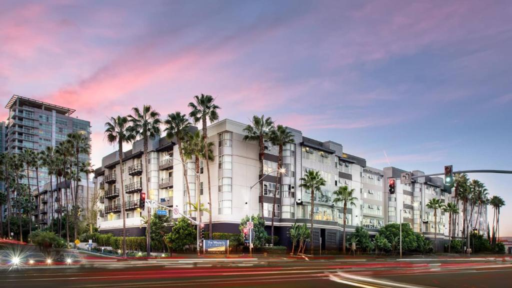 a rendering of a building with palm trees at Exclusive Suites in MDR-Venice with Pool, GYM & HotTub in Los Angeles