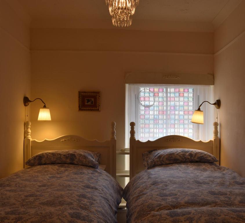 Ліжко або ліжка в номері Y Bwthyn Bach - Taff Trail