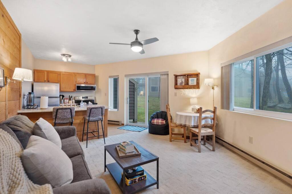 a living room with a couch and a table at Hidden Valley Condo at Resort- Walk to Slope, Golf, Hike in Somerset