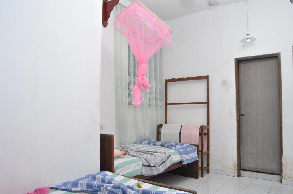 Postel nebo postele na pokoji v ubytování Marshal Beach Guesthouse