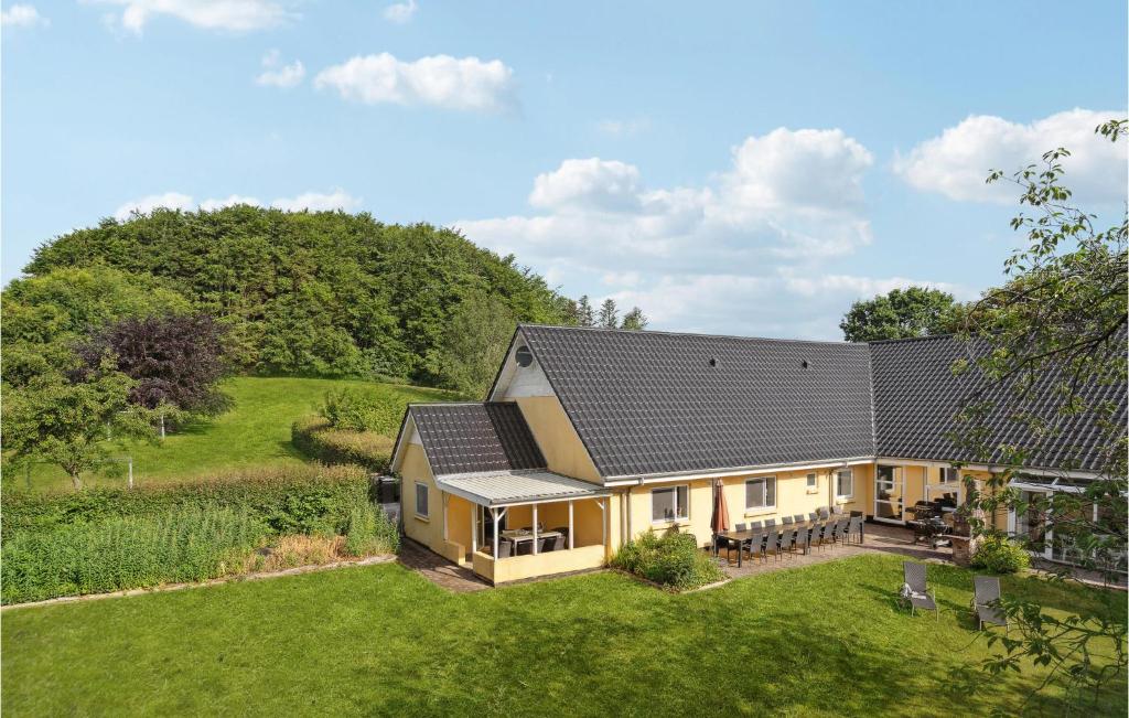 an aerial view of a house with solar panels on it at Cozy Home In Skjern With Wifi in Skjern
