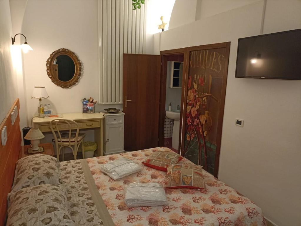 Postel nebo postele na pokoji v ubytování Central GH Formia