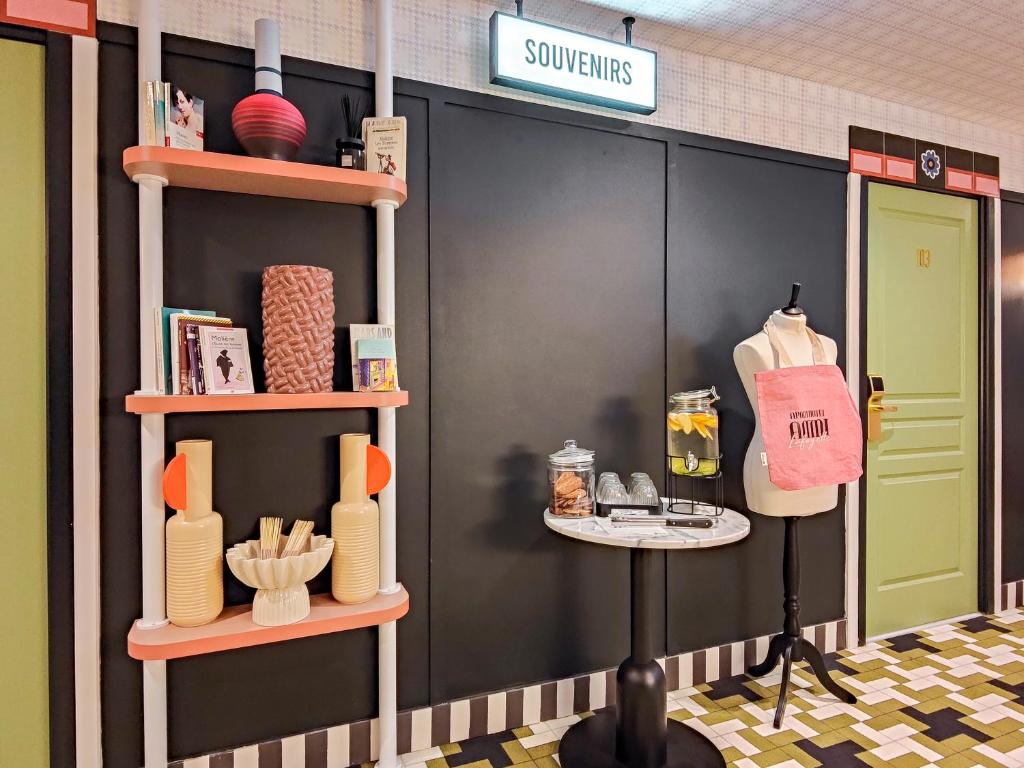 a store front with shelves of products on the wall at Aparthotel AMMI Nice Lafayette in Nice