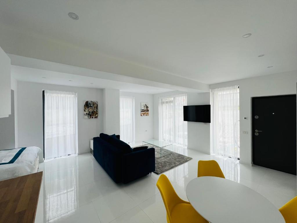 a bedroom with a bed and a living room at Oxygen Residence D3 in Neptun