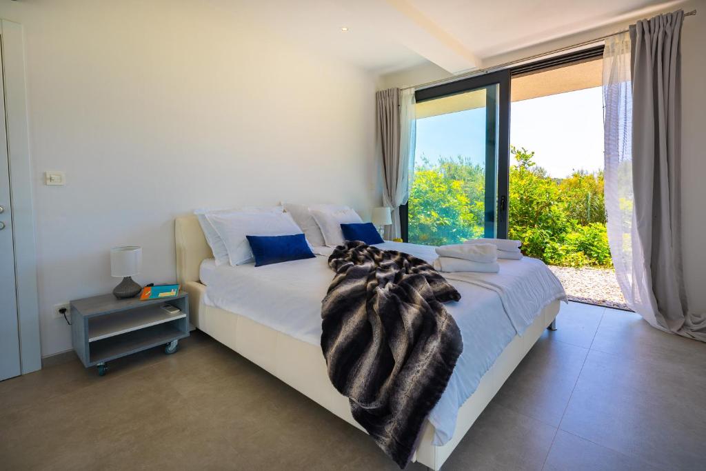 Postel nebo postele na pokoji v ubytování Luxury Hidden Oasis - Greca