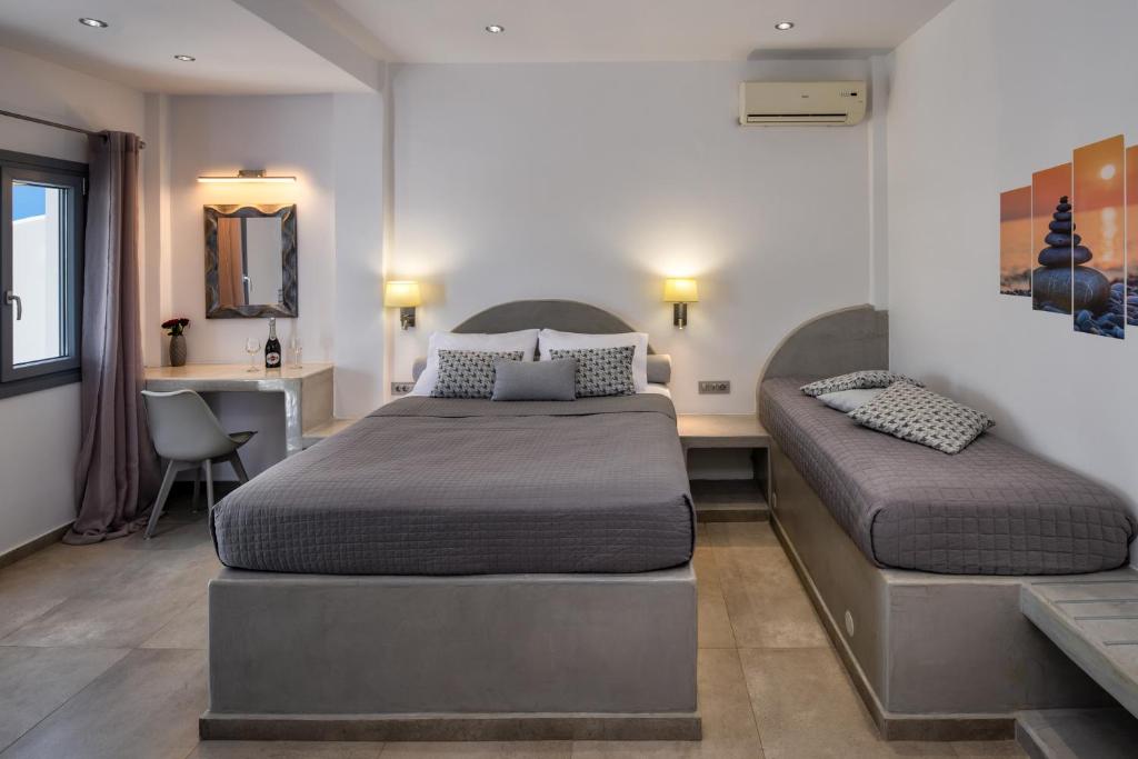 Postel nebo postele na pokoji v ubytování Potamida Suites