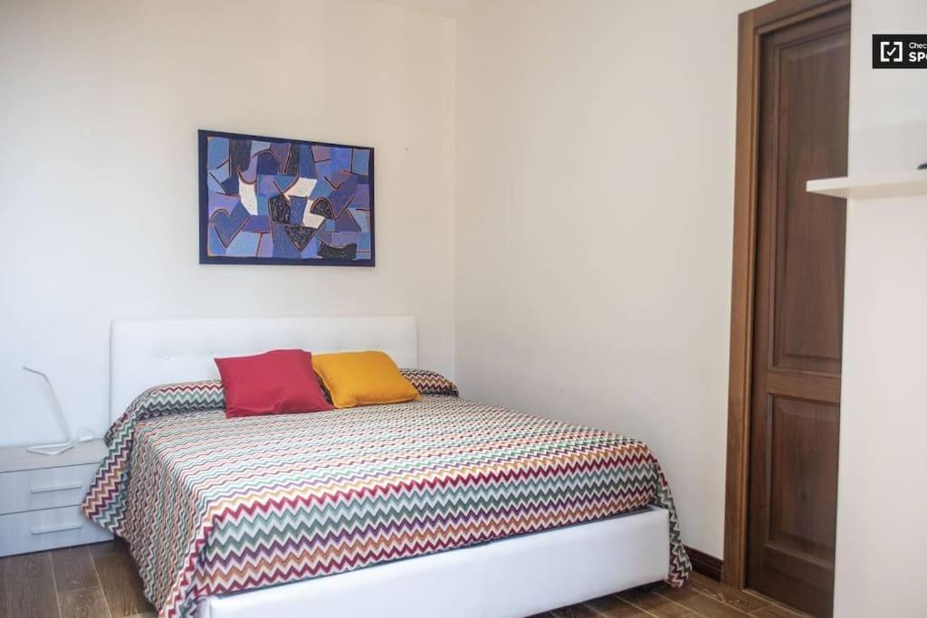 Posteľ alebo postele v izbe v ubytovaní Appartamento Appia Nuova Furio Camillo