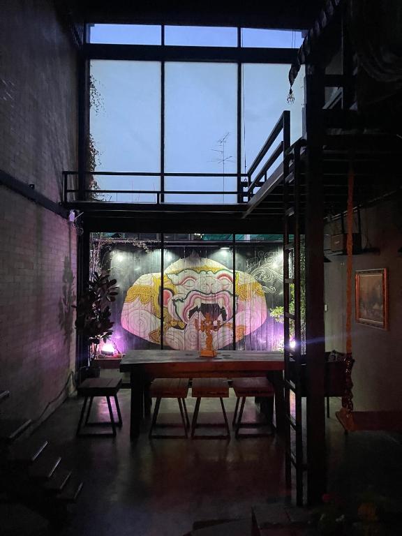 a room with a table with a painting on the wall at New York Loft & Japanese Magic by V4SKIN in Bangkok