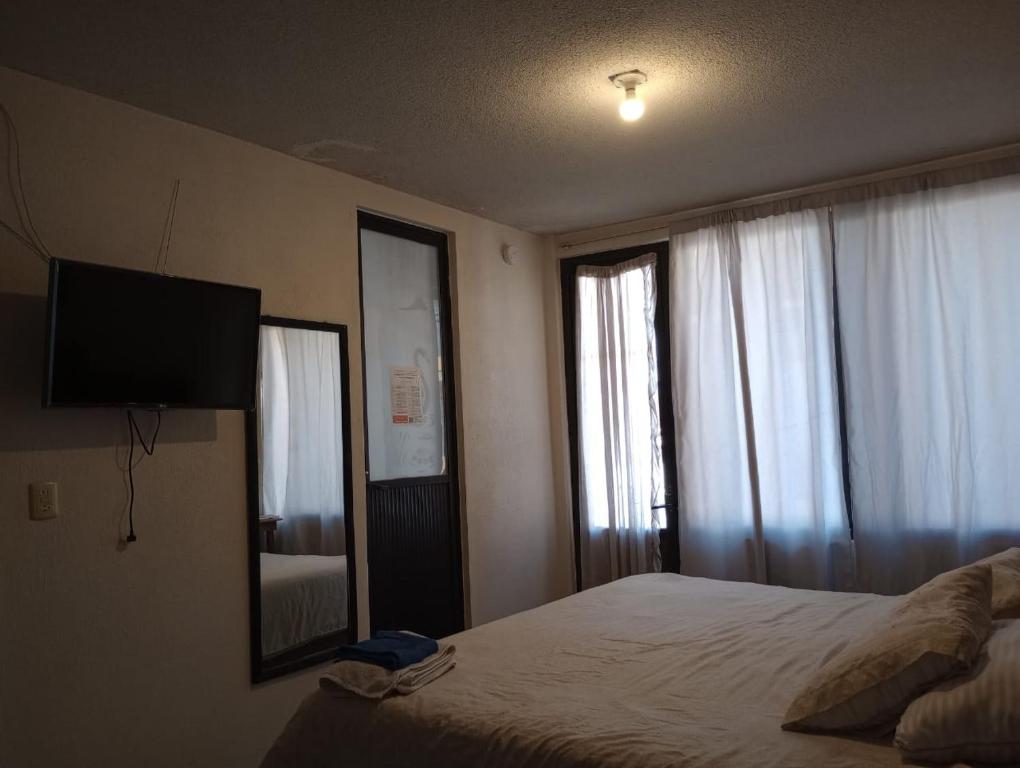 Postel nebo postele na pokoji v ubytování Posada Lindavista