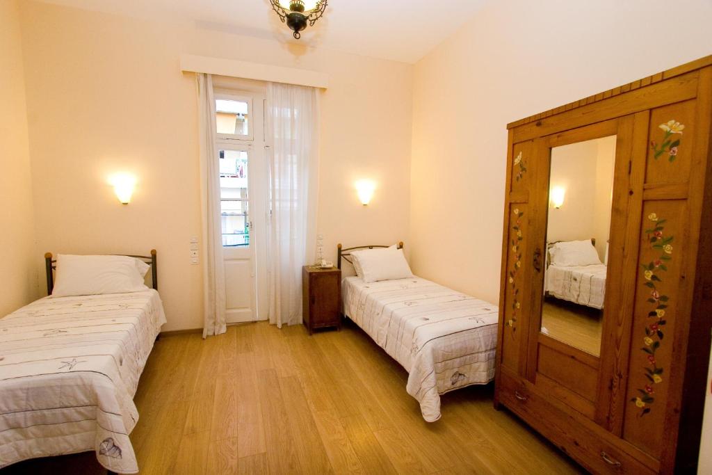 Postel nebo postele na pokoji v ubytování Anesis Hotel
