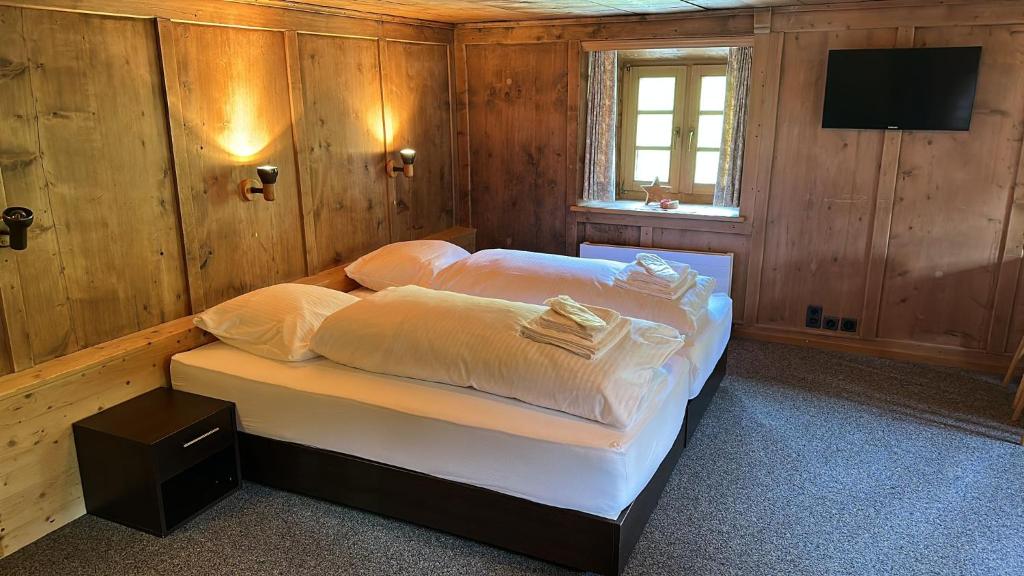 Postel nebo postele na pokoji v ubytování Hotel Tschuggen Davos