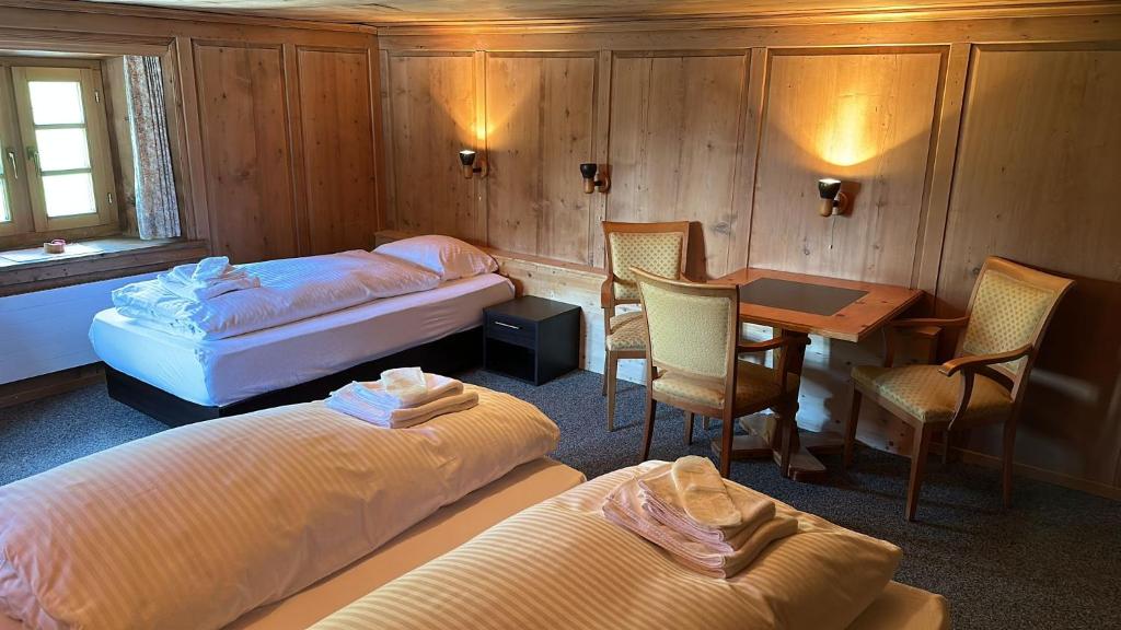 Postel nebo postele na pokoji v ubytování Hotel Tschuggen Davos