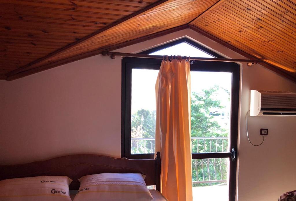 Postel nebo postele na pokoji v ubytování Hotel Gjinaj