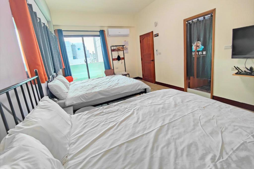 Postel nebo postele na pokoji v ubytování Sofa Potato Homestay