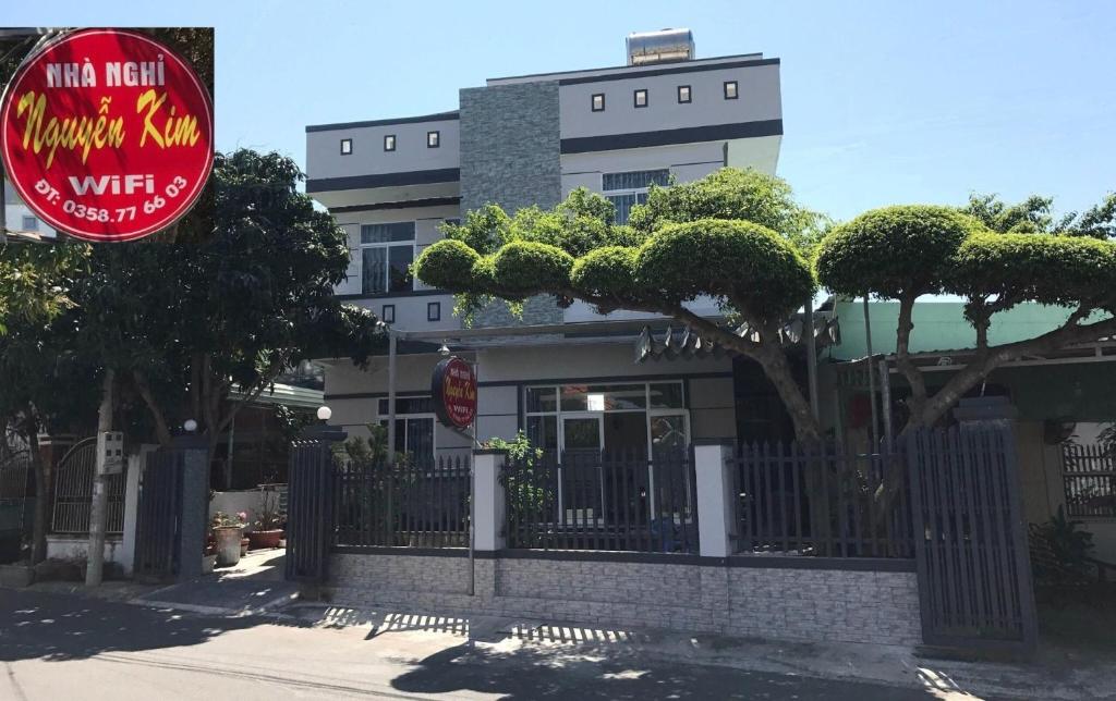 a building with a sign in front of it at Nguyễn Kim Motel in Long Hai