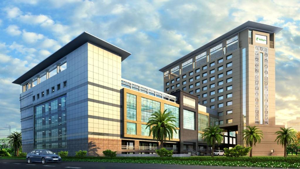 a building with a car parked in front of it at Holiday Inn Chandigarh Zirakpur, an IHG Hotel in Chandīgarh