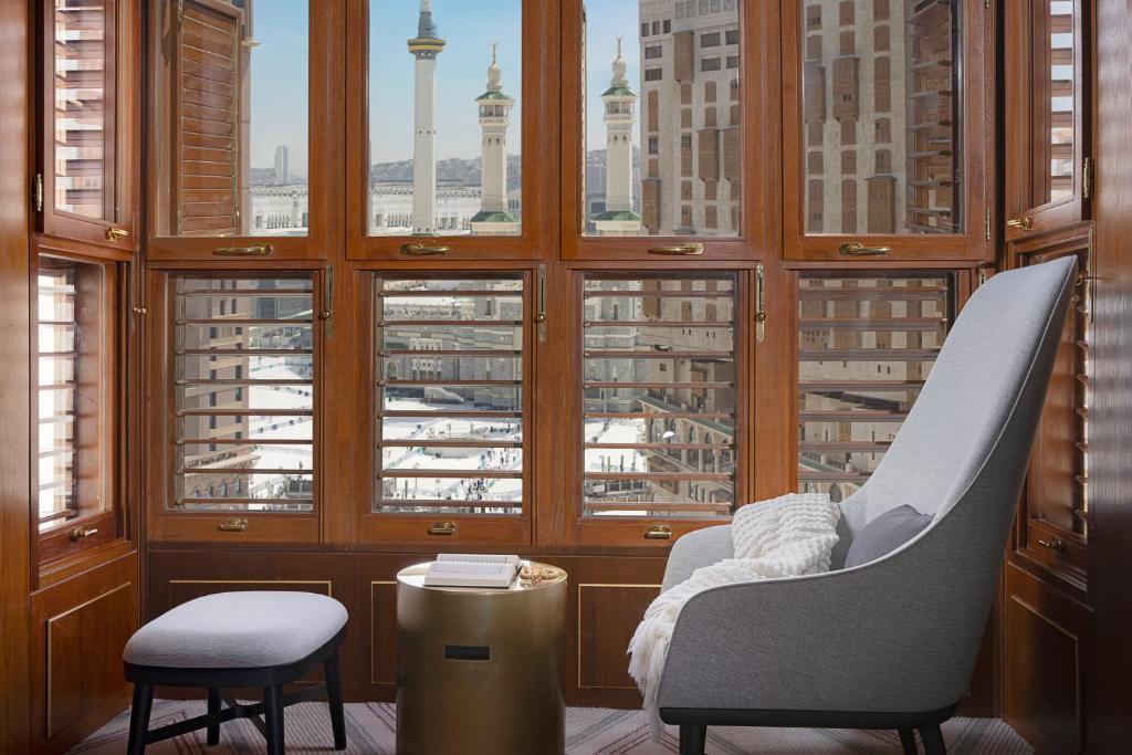 a room with a view of a city from a window at Jumeirah Jabal Omar Makkah in Makkah