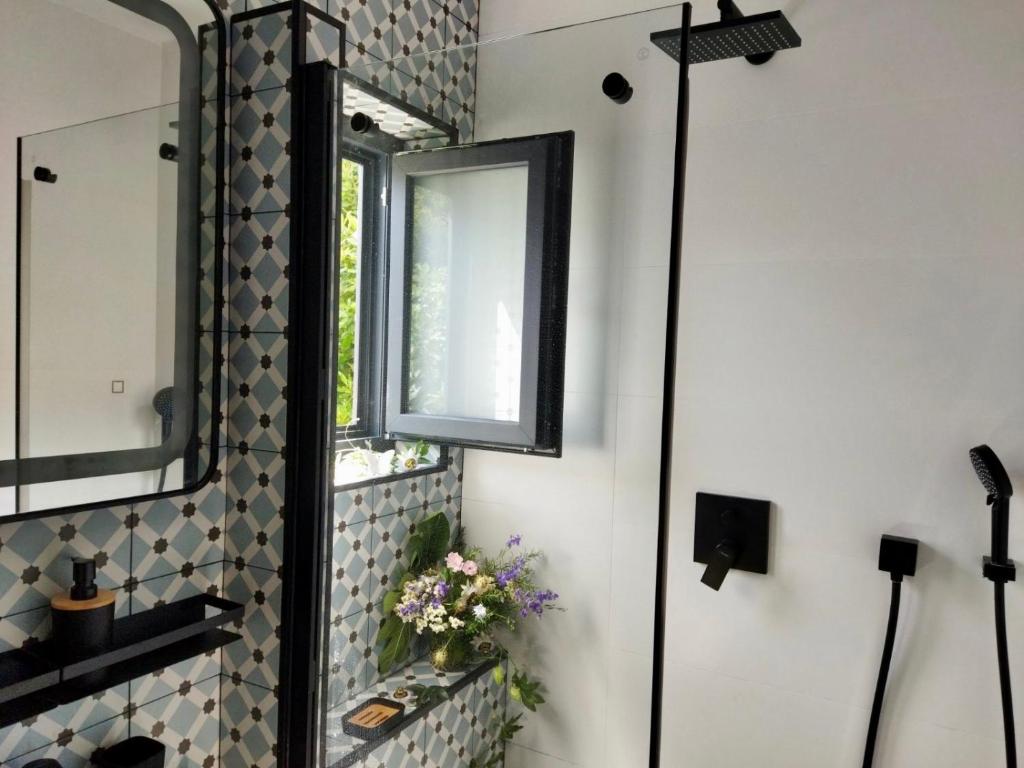 a bathroom with a mirror and a window at Holiday Home Bukovac in Klimno