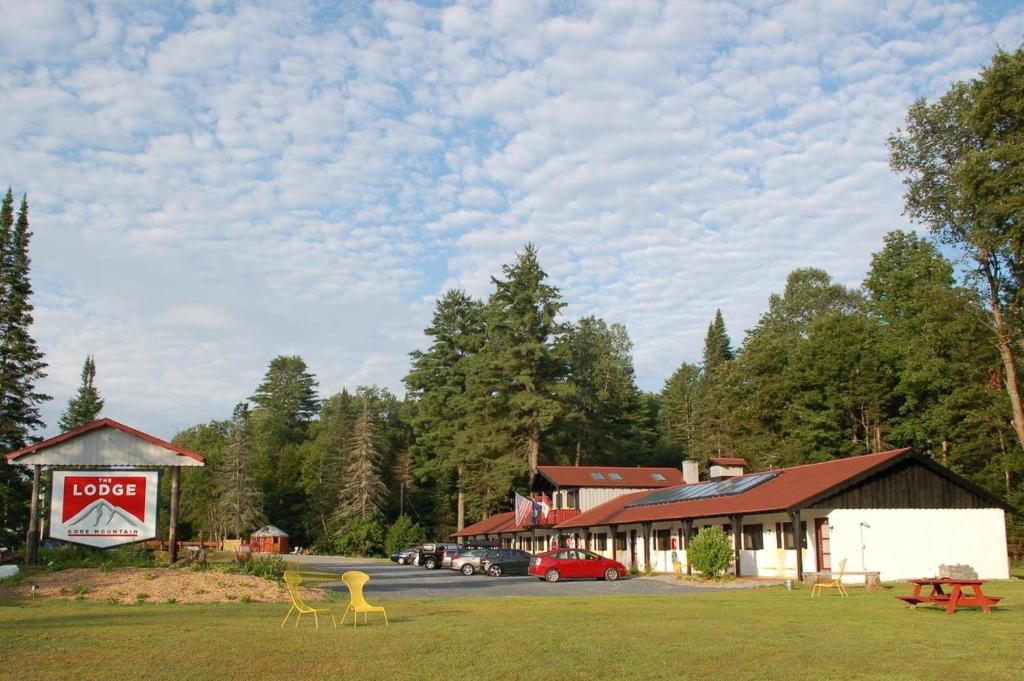a building with a hotel and a parking lot at Gore Mountain Lodge in North Creek