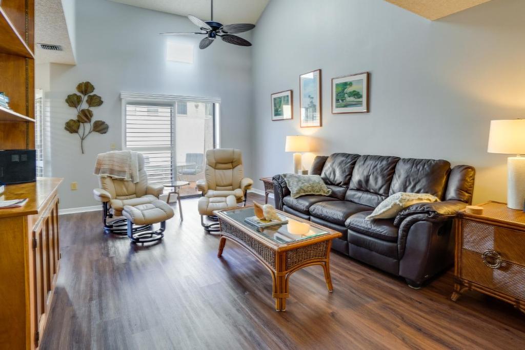a living room with a couch and a table at Walk to Restaurants Downtown Leesburg Townhome! in Leesburg