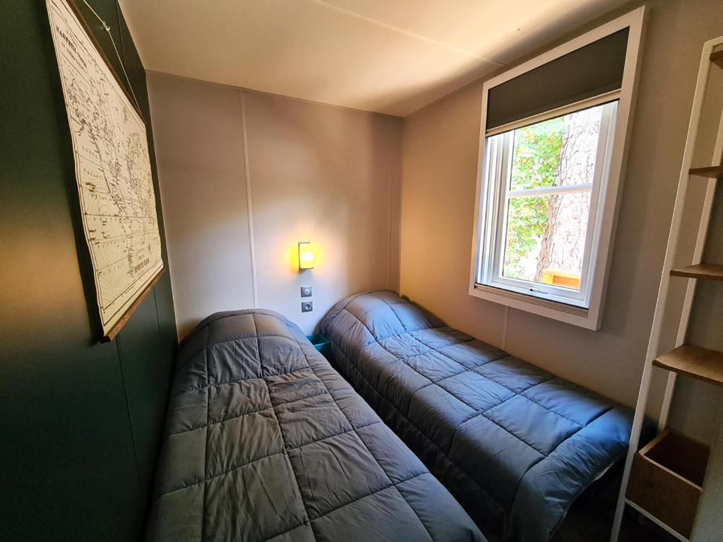 Postel nebo postele na pokoji v ubytování Le Beau Vezé