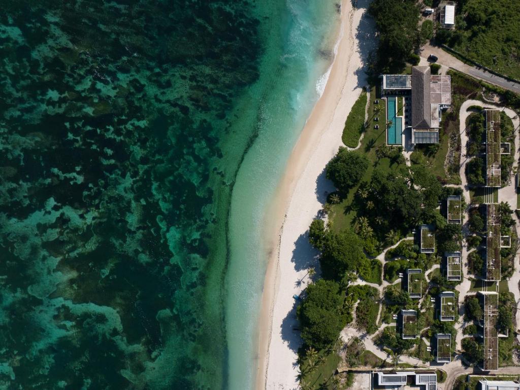 an aerial view of a beach and the ocean at Cap Karoso Sumba - a member of Design Hotels 