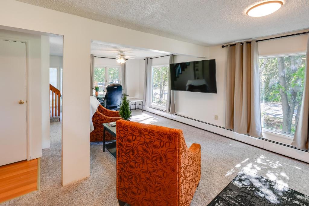 a living room with a couch and a table at Fairbanks Vacation Rental with Aurora Views! in Fairbanks