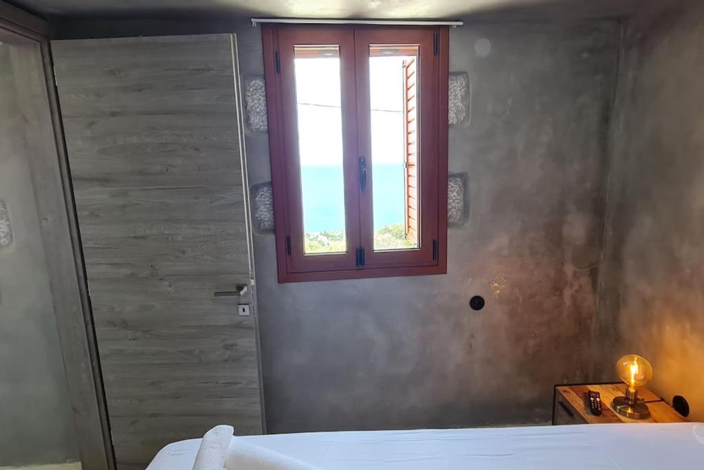 Ένα ή περισσότερα κρεβάτια σε δωμάτιο στο ManiTu