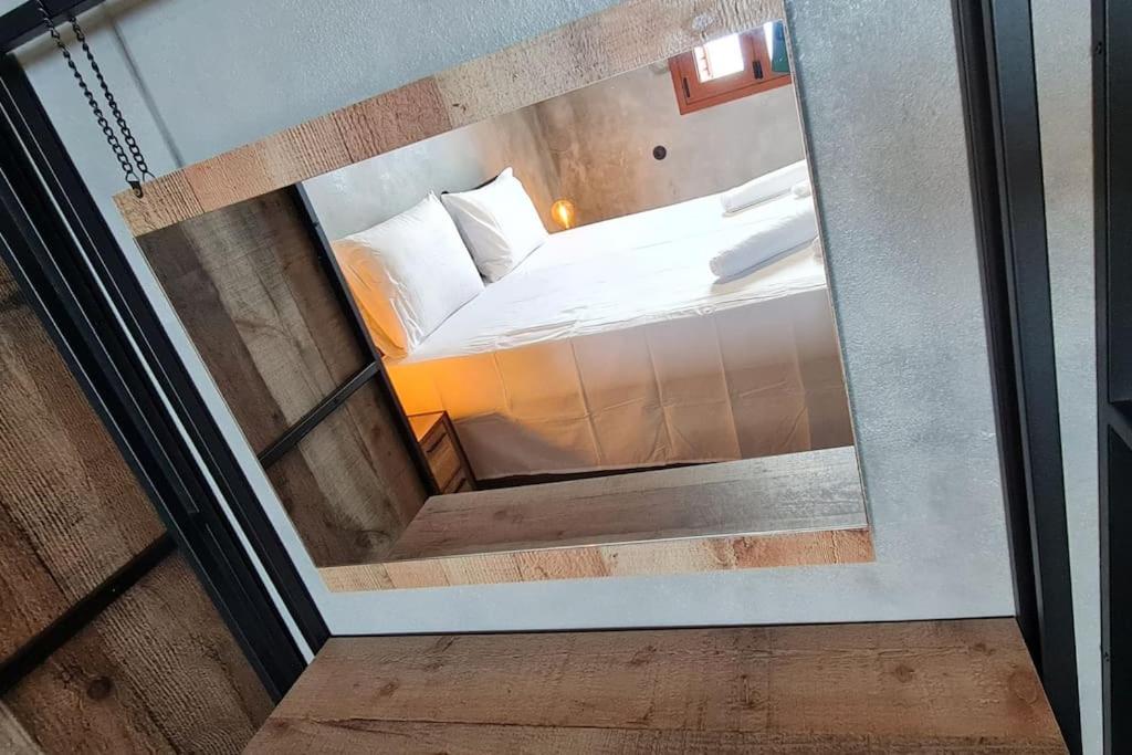 Ένα ή περισσότερα κρεβάτια σε δωμάτιο στο ManiTu