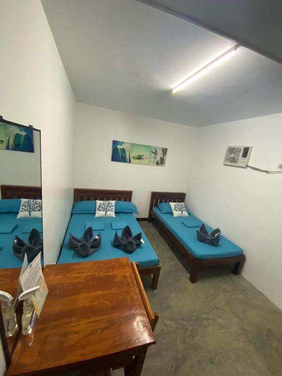 Postel nebo postele na pokoji v ubytování Tres Islas Hostel