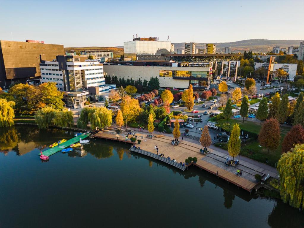 an aerial view of a city with a river at Univers T Hotel in Cluj-Napoca