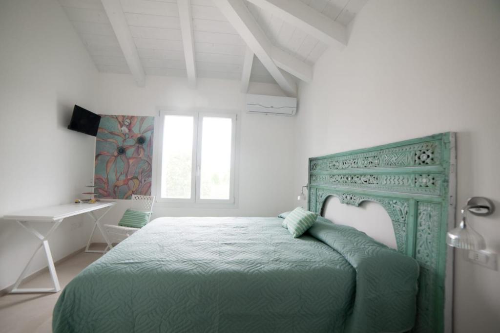 Voodi või voodid majutusasutuse Bed & Breakfast A Mare affitta camere toas
