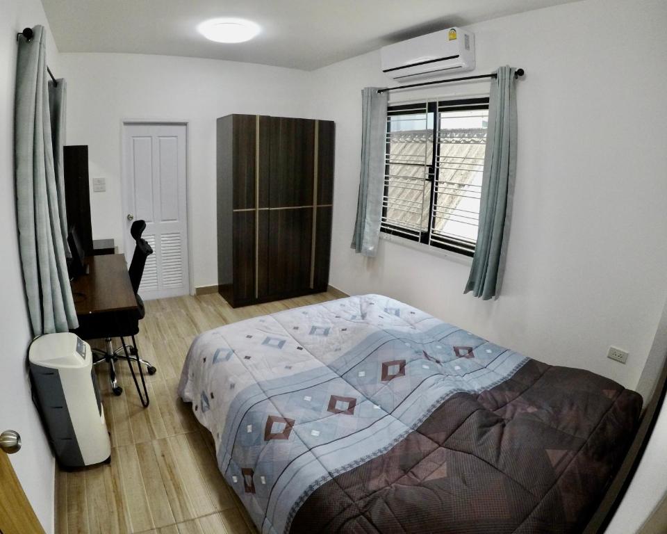 Postel nebo postele na pokoji v ubytování Khod’s House