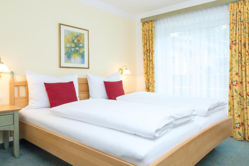 Ein Bett oder Betten in einem Zimmer der Unterkunft Hotel am Schloss