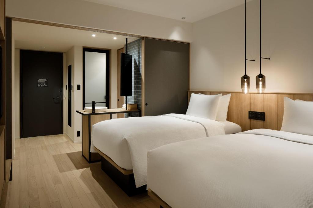 Postel nebo postele na pokoji v ubytování Fairfield by Marriott Gifu Mino
