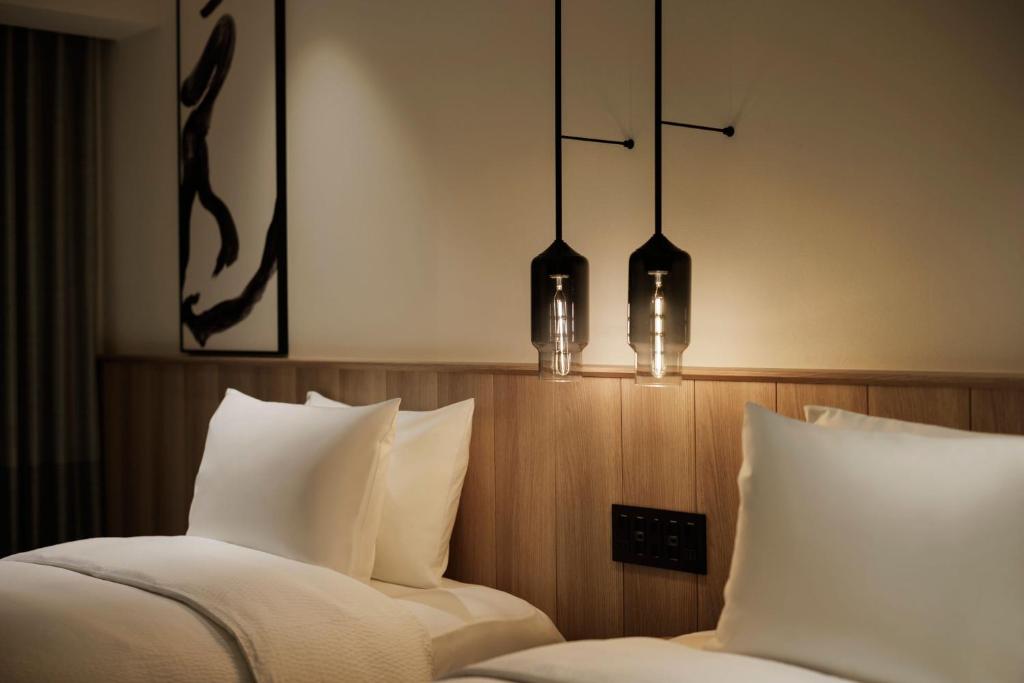 Postel nebo postele na pokoji v ubytování Fairfield by Marriott Gifu Mino