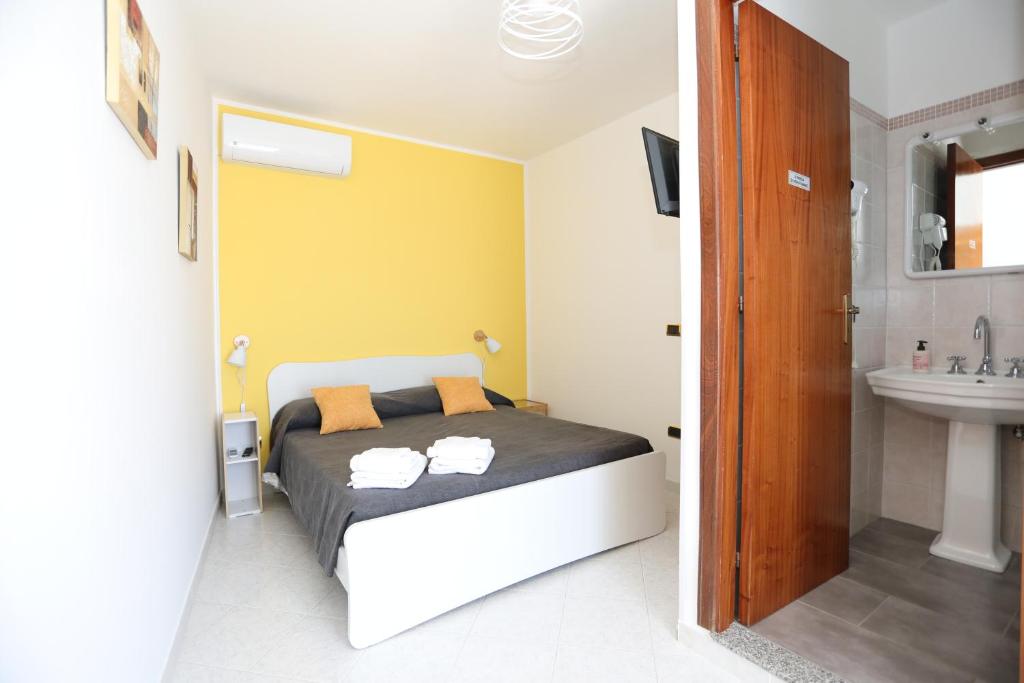 Postel nebo postele na pokoji v ubytování B&B Saracinello