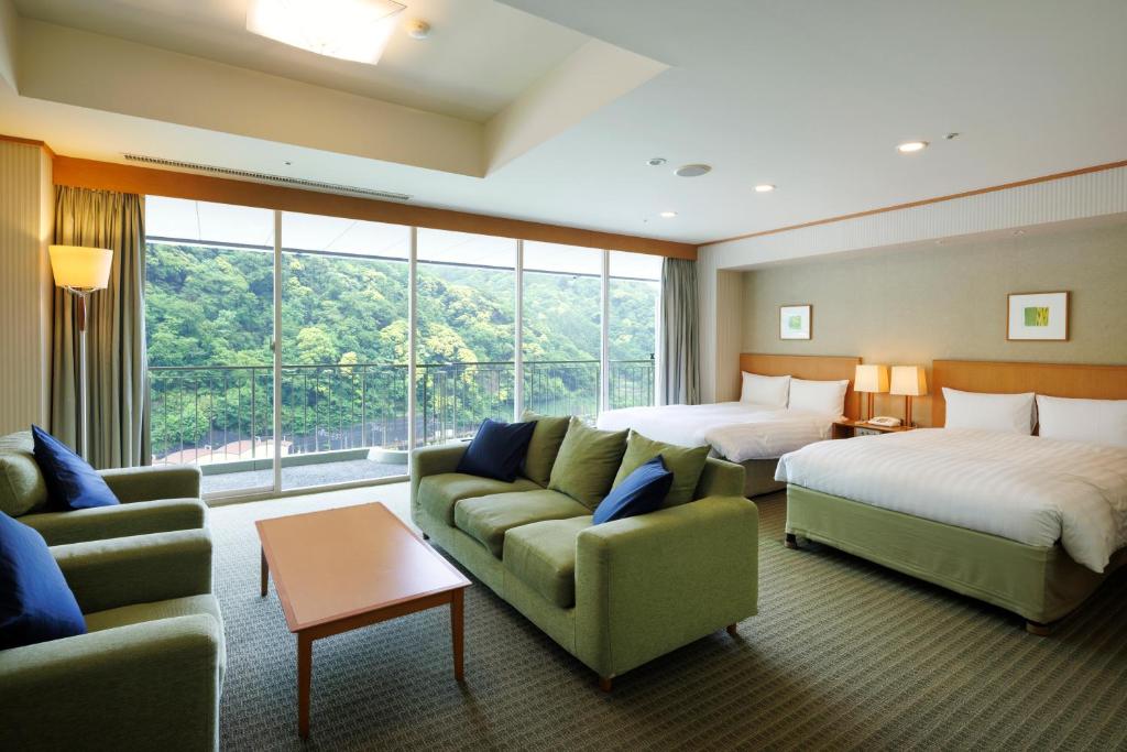 Postel nebo postele na pokoji v ubytování Yumoto Fujiya Hotel